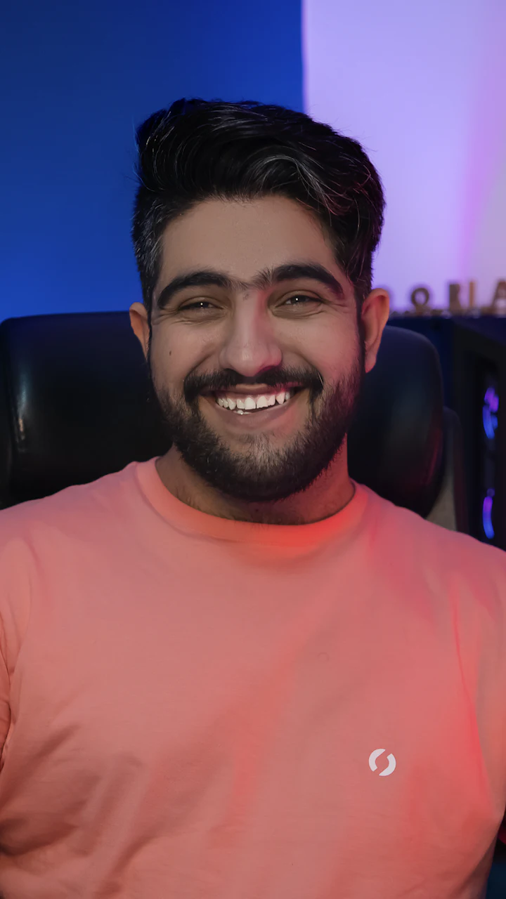 A creator talking to camera at his desk